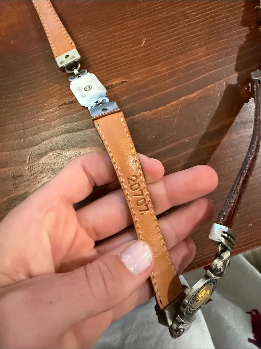 1996 Branded metal and leather accent belt